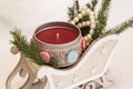 A red candle in a decorative sleigh, an angel with a carved heart. Royalty Free Stock Photo