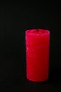 Red candle extinguished on black background. Copy space for text. Romantic. Royalty Free Stock Photo