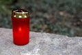 Red candle at a grave Royalty Free Stock Photo