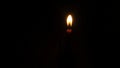 candle light shining in the darkness Royalty Free Stock Photo