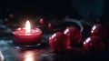 a red candle with some apples around it on a table