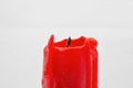 Red candle stub closeup on white Royalty Free Stock Photo