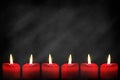 Red candles on black background Royalty Free Stock Photo