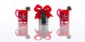 Red candles, candle holders with crystal snowflakes, sugar canes and anise stars and a gift box, isolated on reflective white pers