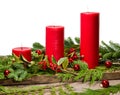 Red candles with cedar boughs Royalty Free Stock Photo