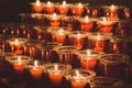 Red candles in the church. Row of glowing candles. Candlelight in the night. Christmas holiday background. Royalty Free Stock Photo