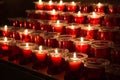 Red candles in the church. Row of glowing candles. Candlelight in the night. Christmas holiday background. Royalty Free Stock Photo