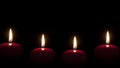 Red candles lighting in the darkness