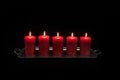 Red candles in a row burning Royalty Free Stock Photo