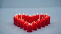 Red Candles in Snow Royalty Free Stock Photo