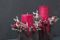 Red candles and wooden reindeers in Christmas table decoration Royalty Free Stock Photo