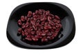 Red canned white beans in black plate isolated on white