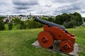 Red cannon in Kristiansten Fortress under a cloudy sky in Trondheim in Norway Royalty Free Stock Photo