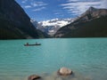 Banff National Park, Canadian Rockies, Red Canoe on Glacial Lake Louise, Alberta, Canada Royalty Free Stock Photo