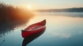 Red canoe on a peaceful lake at sunrise. serene nature scene perfect for posters. outdoor adventure awaits. solitude Royalty Free Stock Photo