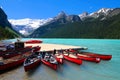 Red canoes in the blue waters of Lake Louise, Banff, Canada