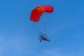 Red canopy powered tandem para glider