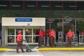 Red Cap Porters with luggage trolleys at Airport