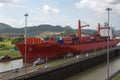 Red Cap Stewart container ship entering in the basin of Miraflores Royalty Free Stock Photo