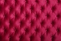 Red capitone tufted fabric upholstery texture Royalty Free Stock Photo