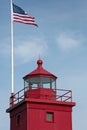 Red Lighthouse with American Flag