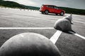 Red car on asphalt parking at daytime