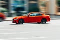 red car BMW M4 F82 is moving fast on the road Royalty Free Stock Photo