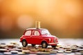 Red car on coins. Car insurance and car loans, concept of savings money on car purchase.