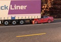 Red car crashed on big truck On the road with environment Royalty Free Stock Photo