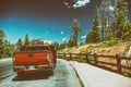 Red car discovering National Park, USA Royalty Free Stock Photo