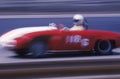 A red car and driver in the Laguna Seca Classic Car Race in Carmel, California