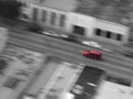 Red Car Driving Downtown in City Fast with Motion Blur Royalty Free Stock Photo