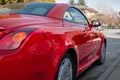 Red car on the empty urban street in a sunny day. Car parked in downtown of Vancouver Canada Royalty Free Stock Photo