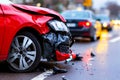A red car that has been involved in a car accident on the side of the road Royalty Free Stock Photo