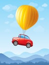 Red car lifted by balloon