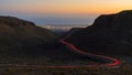 The red car light ribbon on winding road Royalty Free Stock Photo