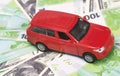 Red car and money, euro and dollars