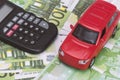 Red car and money, euro and dollars