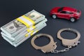 Red car  money handcuffs.  breaking the law auto dealer Royalty Free Stock Photo