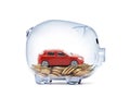 Red car on money inside transparent piggy bank Royalty Free Stock Photo