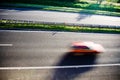 Red car, motion blur Royalty Free Stock Photo