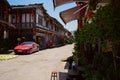 Red car in old-fashioned street in aged town