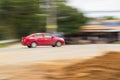 Red Car panning speed on road, Thailand asia