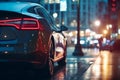 Red car parked on roadside with blurred night city lights background at dark evening time, back view Royalty Free Stock Photo