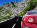 Red car rushing along a high-speed highway. Royalty Free Stock Photo