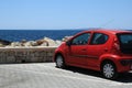 Red car at the sea