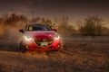 Red car skidding on the ground