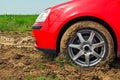 The red car stuck in the mud. Can not fall out of the mud Royalty Free Stock Photo