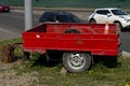 Red car trailer on two wheels with an open top. Royalty Free Stock Photo