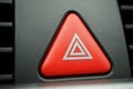 Red car Warning button with a white triangle switching all the vehicle outdoor indicators as a symbol of caution, warning and po